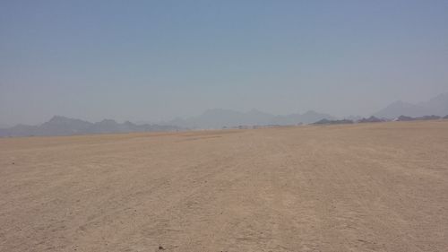 Scenic view of desert against clear sky