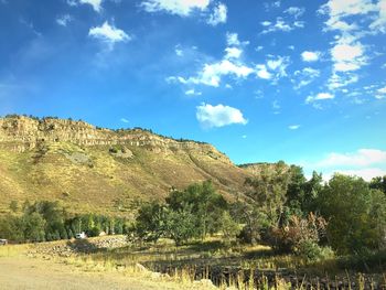Scenic view of mountains against cloudy sky
