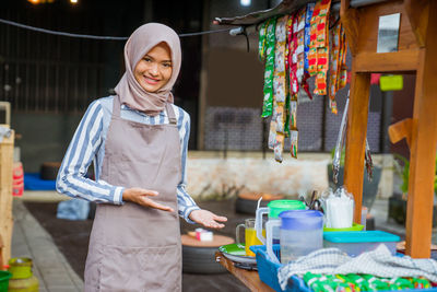 Portrait of young woman using mobile phone