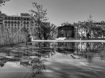 Reflection of buildings in swimming pool