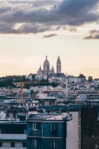 View of buildings against sky at sunset