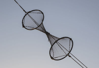 Close-up of electric lamp against clear sky