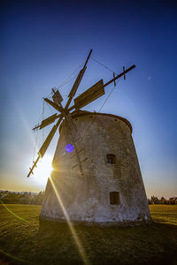 Low angle view of windmill against clear sky