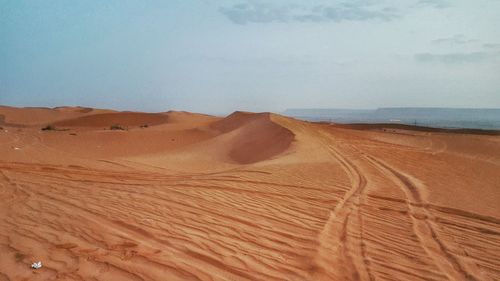 Scenic view of desert against sky