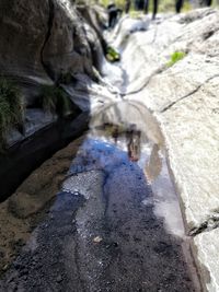 High angle view of water flowing through rocks