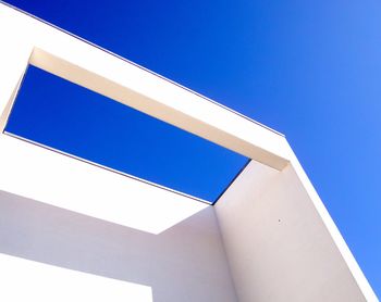 Low angle view of building against clear blue sky