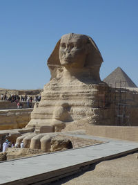 Ancient building against clear blue sky