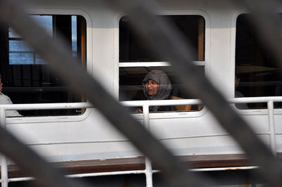Man seen through train window