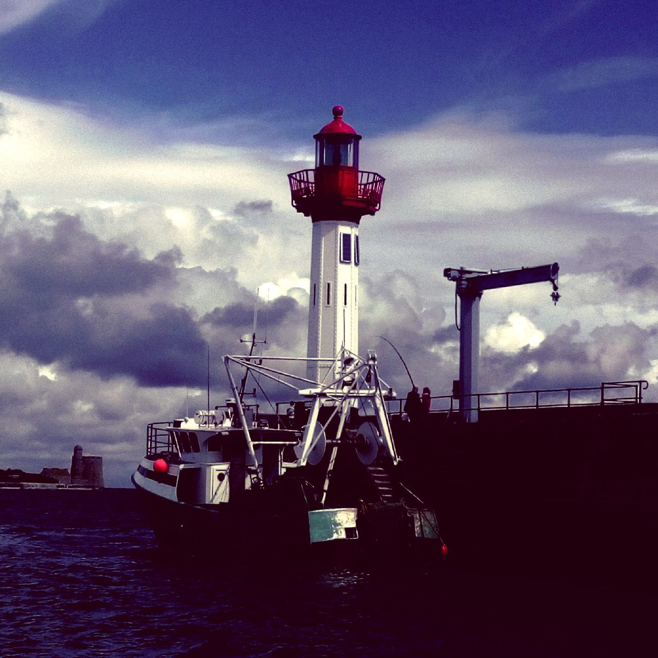 lighthouse, sky, sea, water, guidance, built structure, architecture, cloud - sky, building exterior, direction, safety, protection, security, red, nautical vessel, cloud, transportation, day, waterfront, outdoors