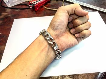 Close-up of hands on table