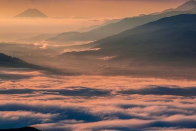 Scenic view of mountains against sky at sunset