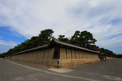 Kyoto imperial palace against cloudy sky