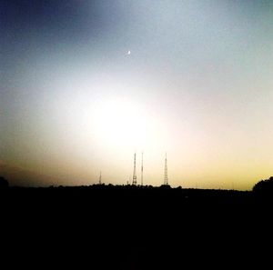 Silhouette landscape against clear sky during sunset