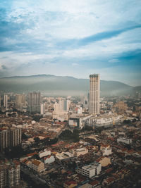 High angle view of buildings in city against sky