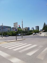 City street and buildings against sky