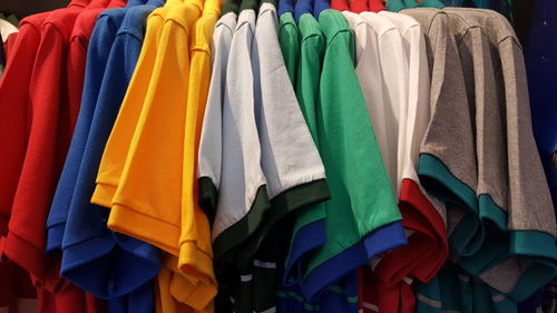Close-up of colorful clothes hanging on display at store