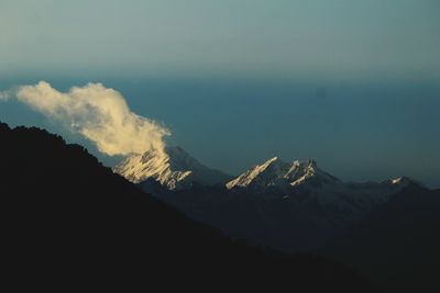 Scenic view of mountains against sky at night