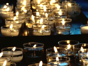 Close-up of lit tea light candles