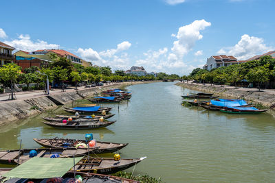 Hoi an thu bon river boats floating on the river bank. hoi an, vietnam