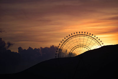 Ferris wheel against sunrise, in nha trang, vietnam