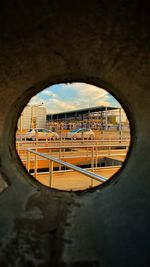 Buildings seen through hole in window