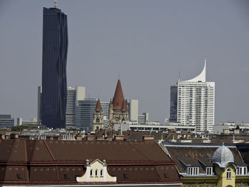 Modern buildings in city against sky