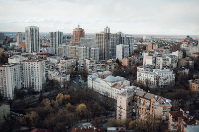 High angle view of buildings in city against sky