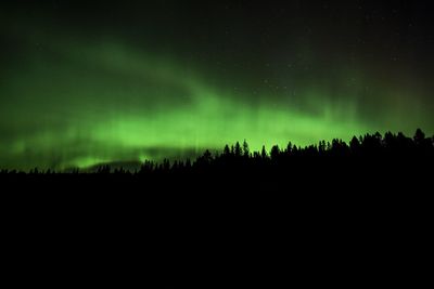 Scenic view of silhouette landscape against sky at night