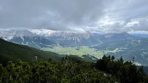 Scenic view of snowcapped mountains against sky