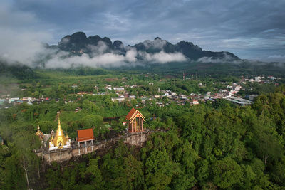 High angle view of trees and buildings against sky