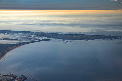 High angle view of sea against sky during sunset