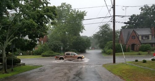 Cars on road in rainy season