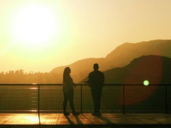 Silhouette of woman at sunset