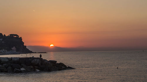 Scenic view of sea against sky during sunset