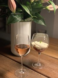 Close-up of wine glasses on table