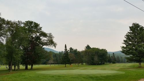 View of golf course against sky