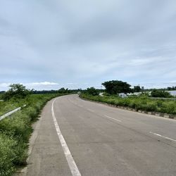 Empty road along landscape