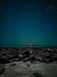 Scenic view of sea against sky at night