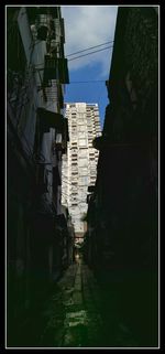 Alley amidst buildings in city