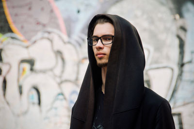 Portrait of young man looking away