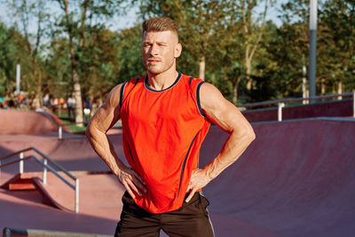 Portrait of young man exercising in gym