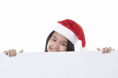 Portrait of a smiling girl over white background