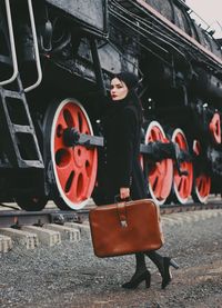 Man standing on railroad track