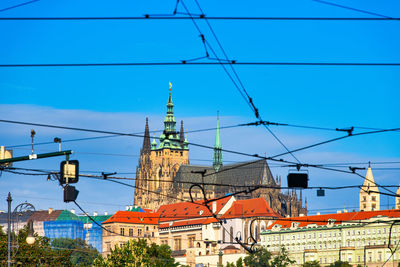 Low angle view of buildings against clear blue sky