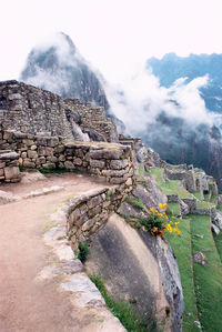 Scenic view of mountain against cloudy sky