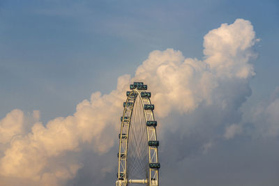 Low angle view of communications tower against sky