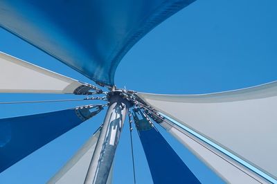 Low angle view of bridge against clear blue sky