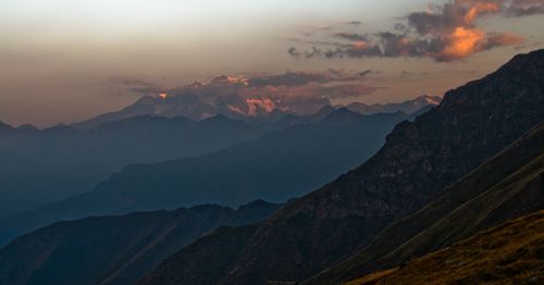 Scenic view of mountains against dramatic sky