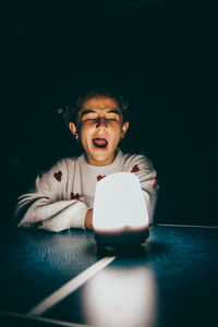 Sleepy girl with a lamp