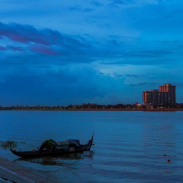 water, sky, blue, cloud - sky, waterfront, sea, building exterior, nautical vessel, scenics, built structure, architecture, tranquility, tranquil scene, beauty in nature, cloud, nature, cloudy, boat, mode of transport, transportation